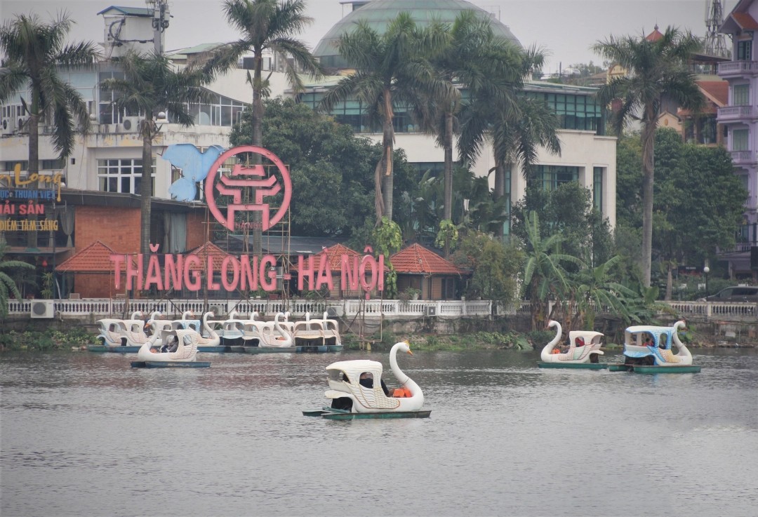 Things to Do around West Lake: Paddle around the lake in a swan pedalo