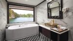 Aspira Cruise Suite Elegant Bathroom with Long Bathtub