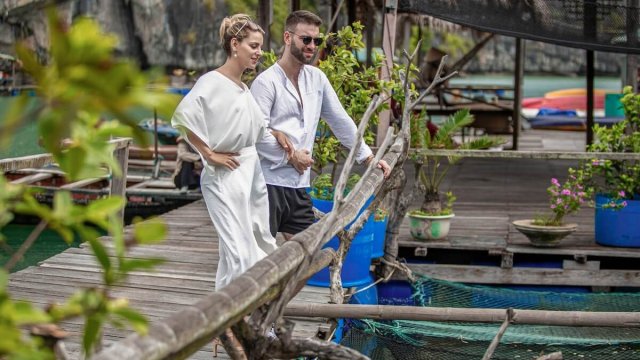 Emperor Cruise Couple Visiting Floating Villages