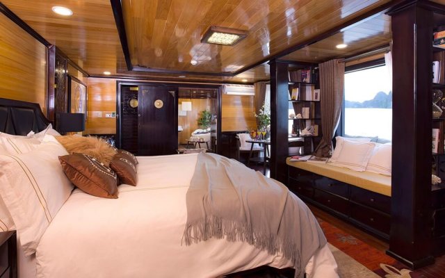 Hera Cruise Suite with a Small Bench next to a Large Glass Window for Sightseeing
