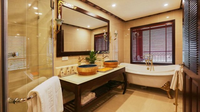 Indochine Cruise Suite Bathroom with Standing Shower and Long Bathtub