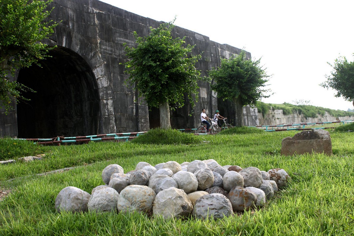 The stone cannonballs in front of the gate of the Citadel of the Ho Dynasty