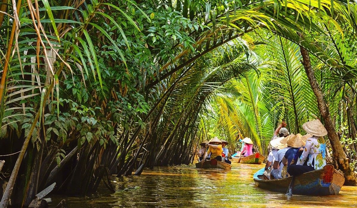 Taking a boat along Mekong River is the best way to fully experience the natural environment of Mekong Delta