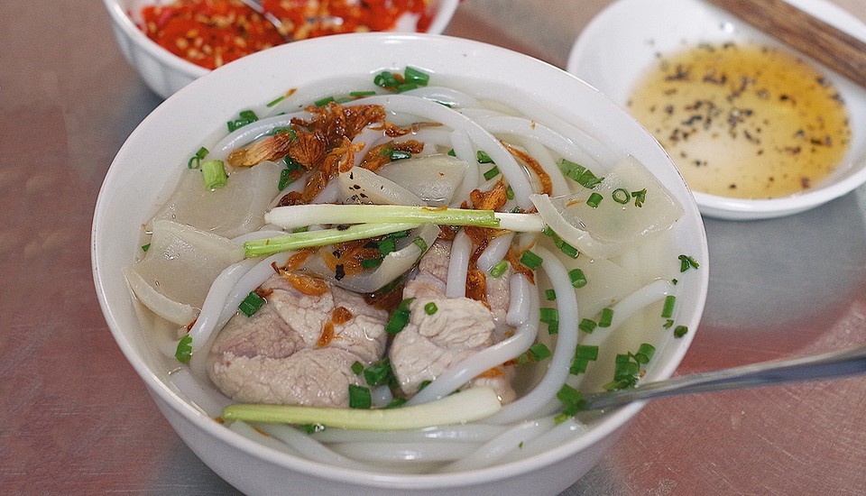 Best Local Food in Saigon - Banh Canh, a Vietnamese thick noodle soup, offers a delightful twist to Saigon's culinary offerings