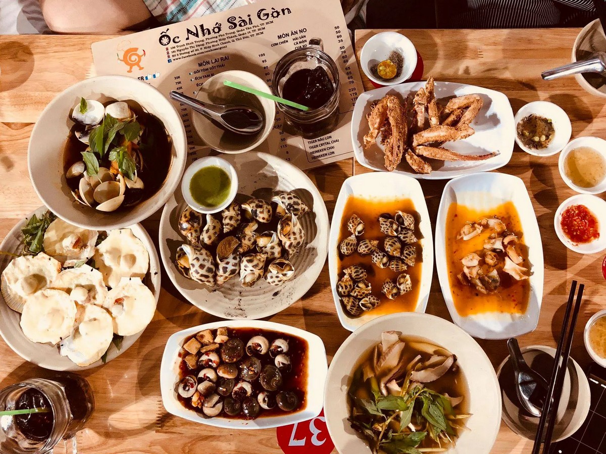 Best Local Food in Saigon - Saigon's local food scene presents Oc, a beloved delicacy of snails prepared in various styles