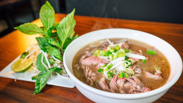 Crafting Pho Vietnam involves a meticulous dance of simmering broth, spices, and expert noodle preparation