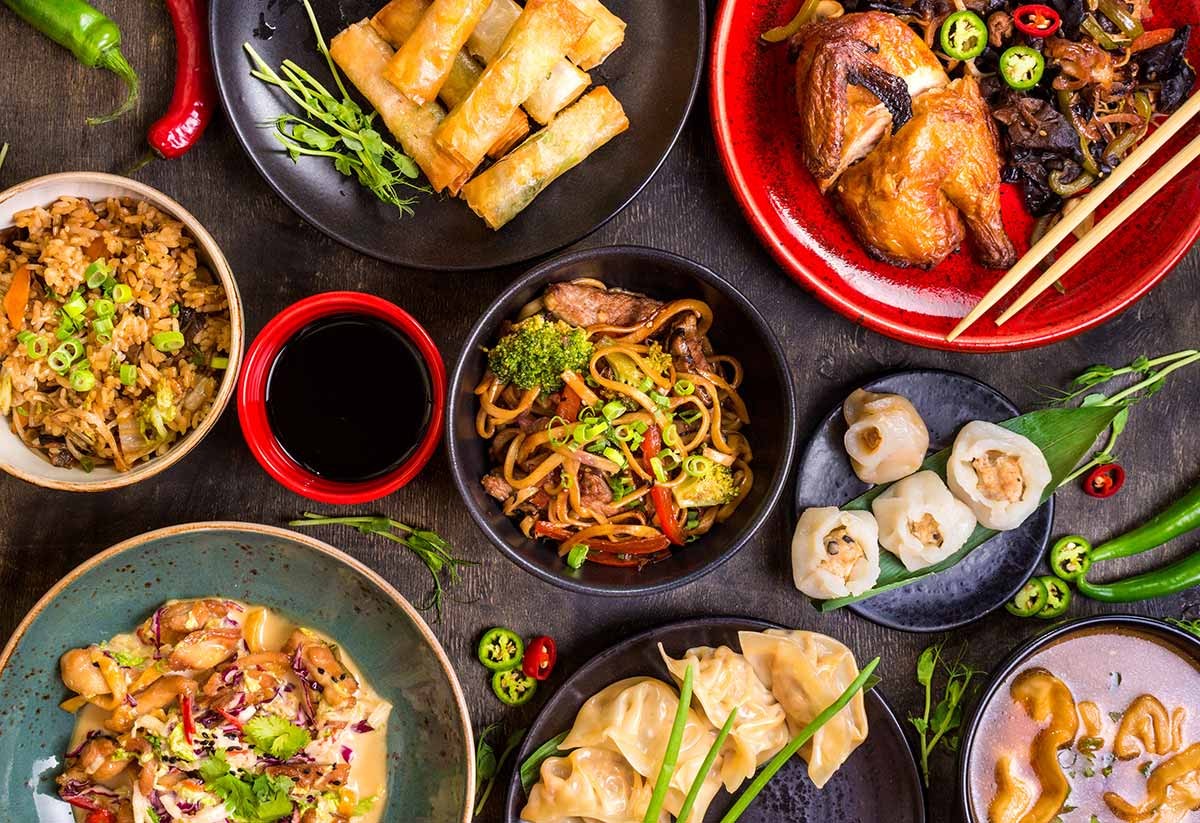 Indulge in China's diverse cuisine, savoring Peking duck, dim sum, and regional specialties