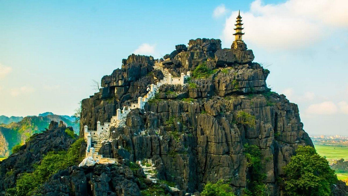 Tourist Attractions in Ninh Binh - Mua Cave offers breathtaking views from its summit, accessed by climbing 500 stone steps