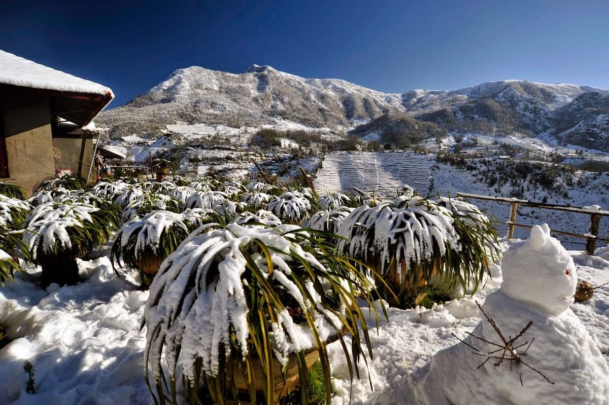 Sapa Vietnam Winter Snow blankets Cat Cat Village in white during the early days of winter