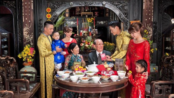 tet vietnamese new year The first visitor of the New Year symbolizes luck and prosperity in Vietnamese tradition