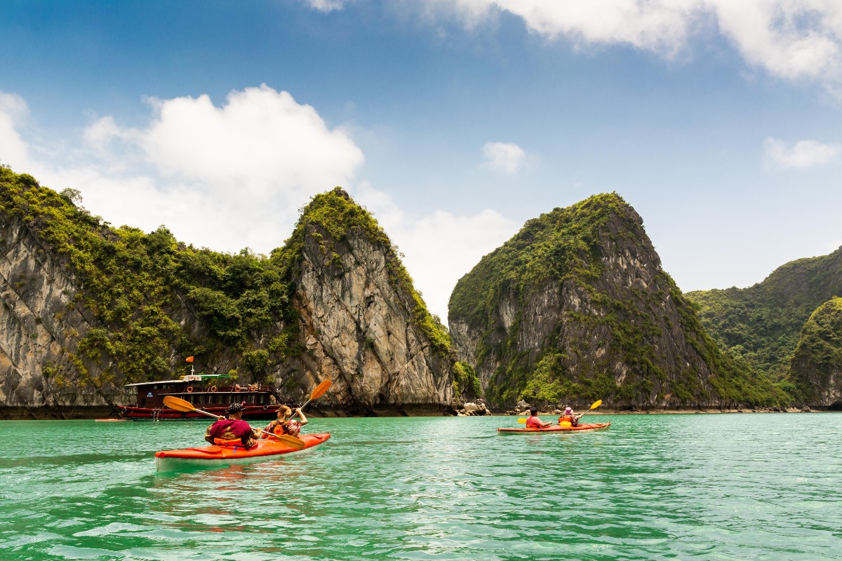 things to do in vietnam Kayaking through Halong Bay pristine waters and towering limestone karsts