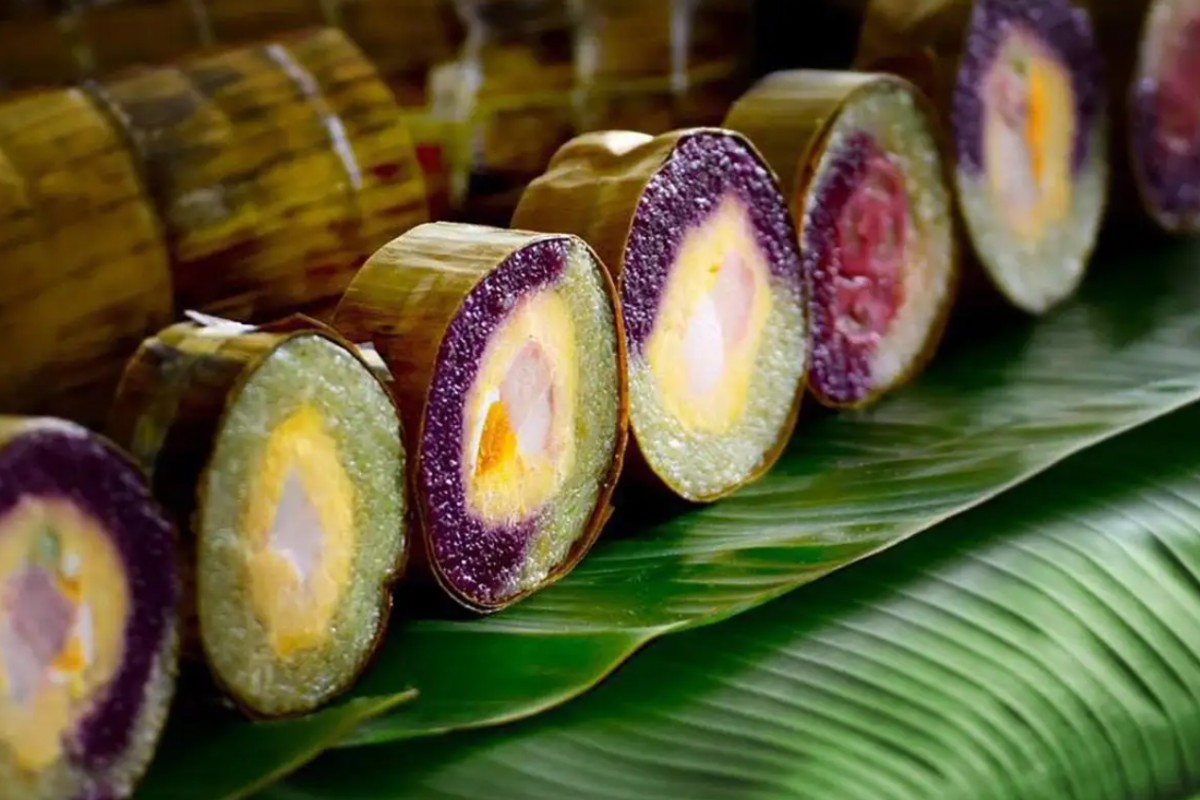 vietnamese new year food Banh tet, a traditional Vietnamese sticky rice cake, holds a special place during Tet