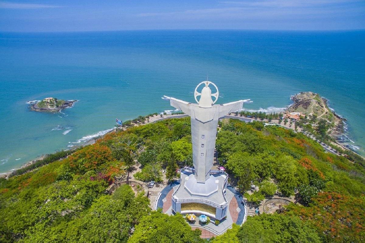 Hon Ba Island Vung Tau is located to the left of the statue of Christ the King