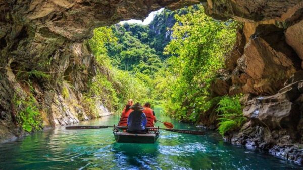 Ninh Binh Boat Tour Glide through the caves on a boat at Trang An