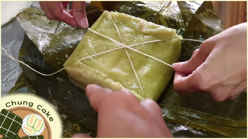 Locals cut Chung Cake by bamboo strings